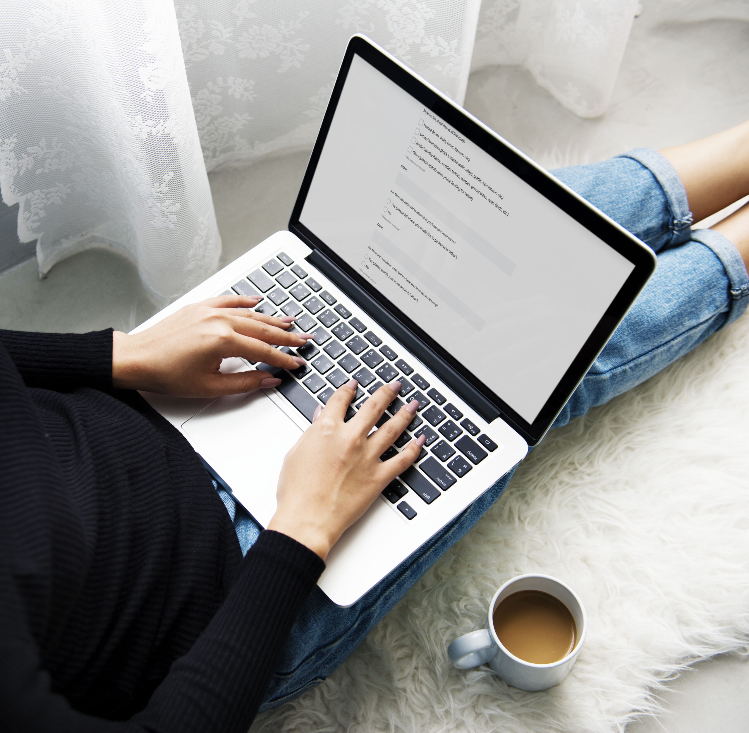 girl sitting on floor on laptop