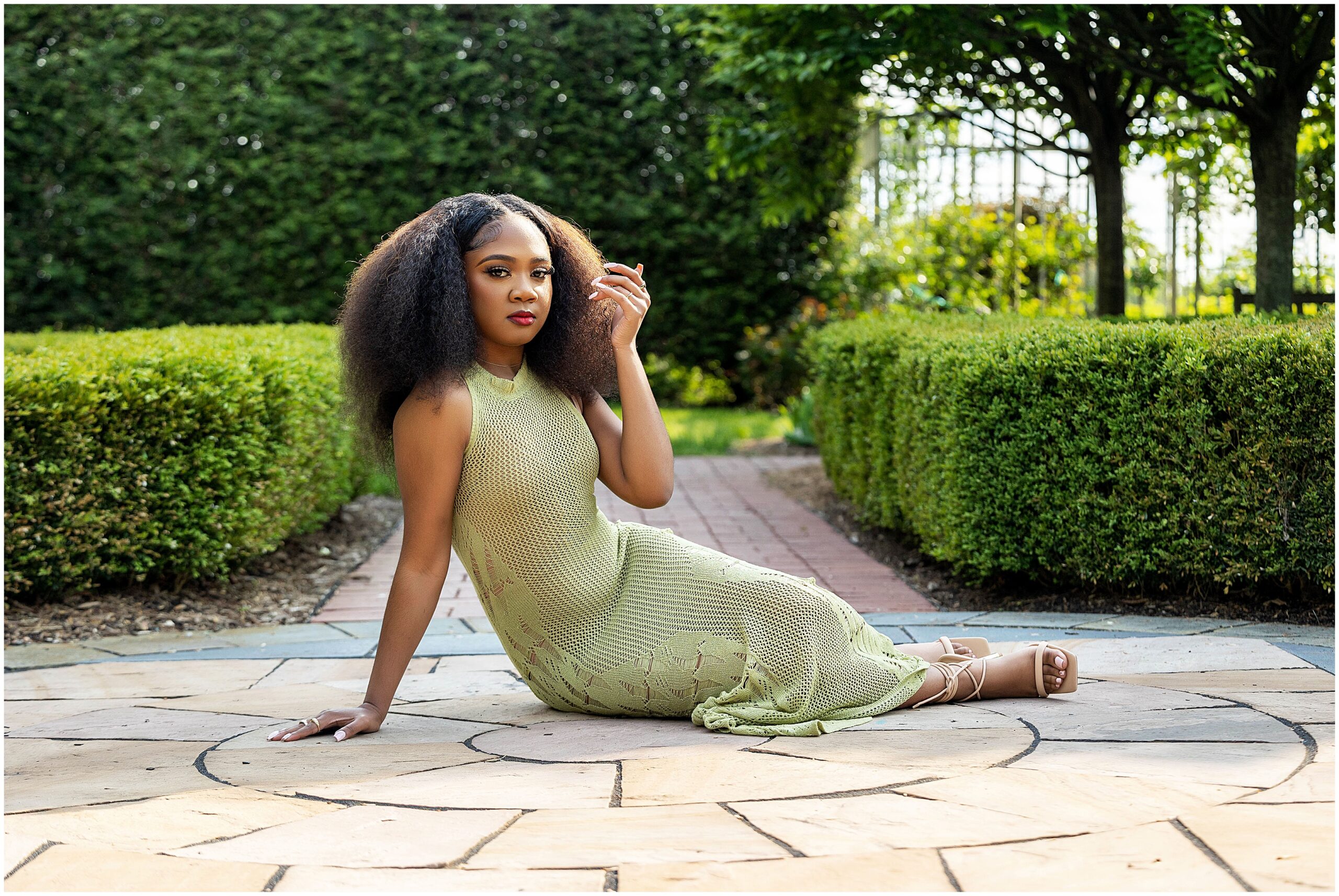 African American girl at Taylor Botanical Gardens taking senior pictures